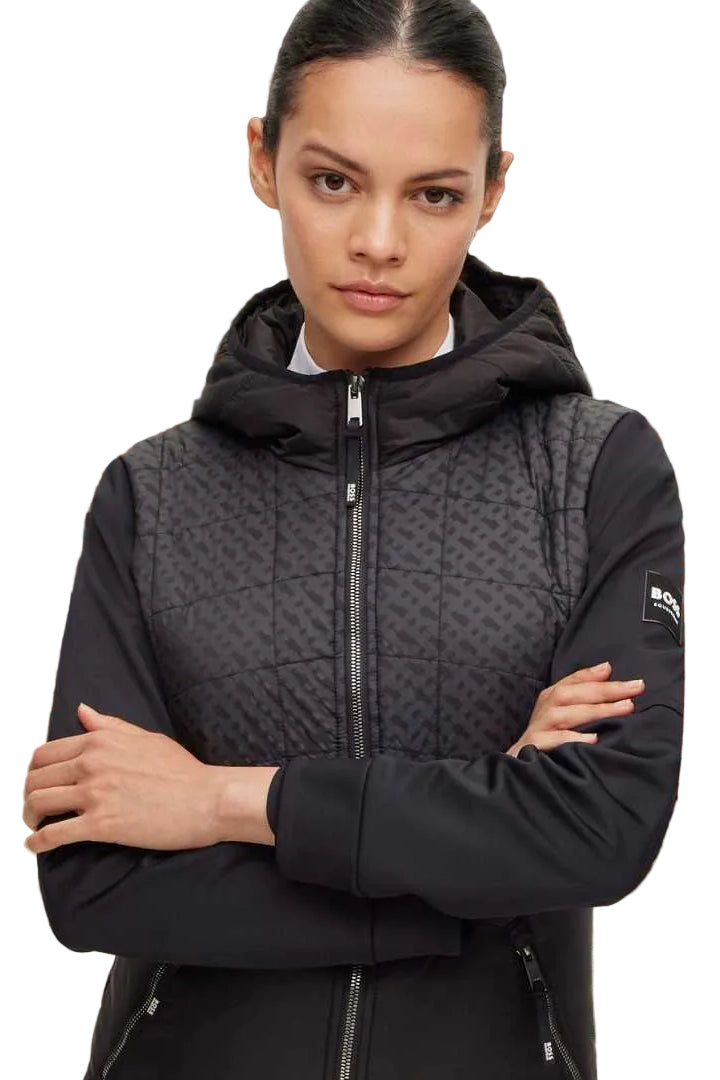 Die Datei beinhaltet Informationen über eine Damenjacke mit dem Namen "Bruna Performance" von der Marke BOSS. Die Jacke ist winddicht und wasserdicht. Die Artikelnummer lautet B1W1403-001, und die Jacke ist in der Farbe Schwarz erhältlich. Sie kann auf der Website www.hotti24.de erworben werden.