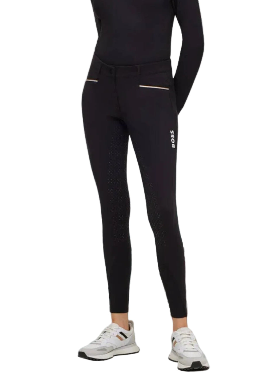 Damen Reithose "Heather FullGrip" von BOSS Equestrian. Diese Reithose ist in der Farbe Schwarz erhältlich und trägt die Artikelnummer B1W1301-001. Die "Heather FullGrip" Damen Reithose wurde speziell für Reiterinnen entwickelt, um Komfort und Halt im Sattel zu bieten. Sie haben die Möglichkeit, die Reithose von vorne, von der Seite und von hinten zu betrachten, um einen umfassenden Eindruck zu erhalten. Sie können diese Damen Reithose auf der Website www.hotti24.de erwerben