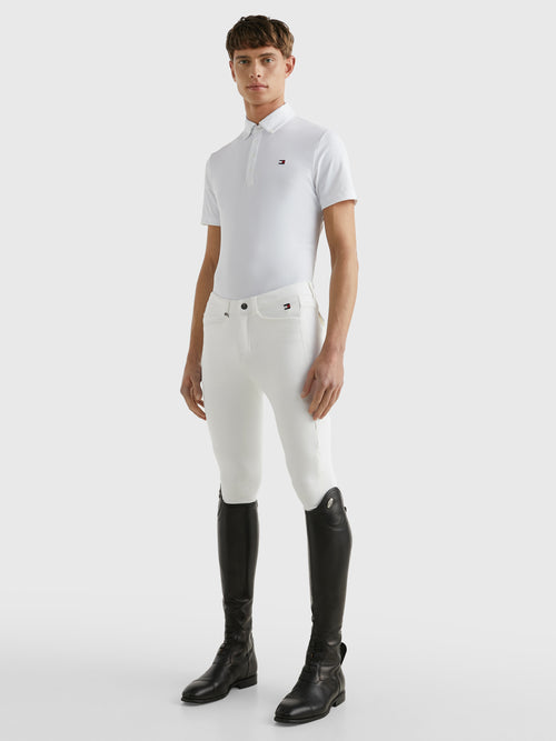 Tommy Hilfiger Equestrian® »Herren Turniershirt Poloshirt Fresh Air Weiß, mit Knopfleiste und Button down Kragen. Luftzirkulierendes Pique-Material. Mit gesticktem Flag-Logo vorne links auf der Brust und aus einem schnell trocknenden, desodorierenden Material Artikelnummer th07msss301-001 erhältlich bei www.Hotti24.de