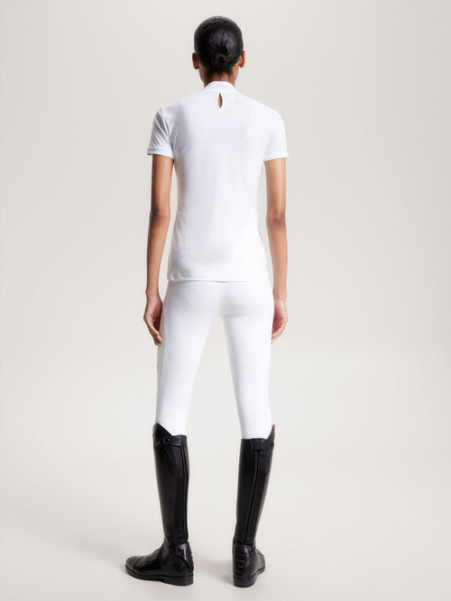 Tommy Hilfiger Equestrian® »Damen Turniershirt Chelsea Weiß, aus einem 4-Wege-Stretchmaterial mit dezenter Textur, das Sie kühl und trocken hält, wenn es darauf ankommt, und einem schicken Stehkragen mit Druckknopfverschluss Artikelnummer th13wsss678-001 erhältlich bei www.Hotti24.de
