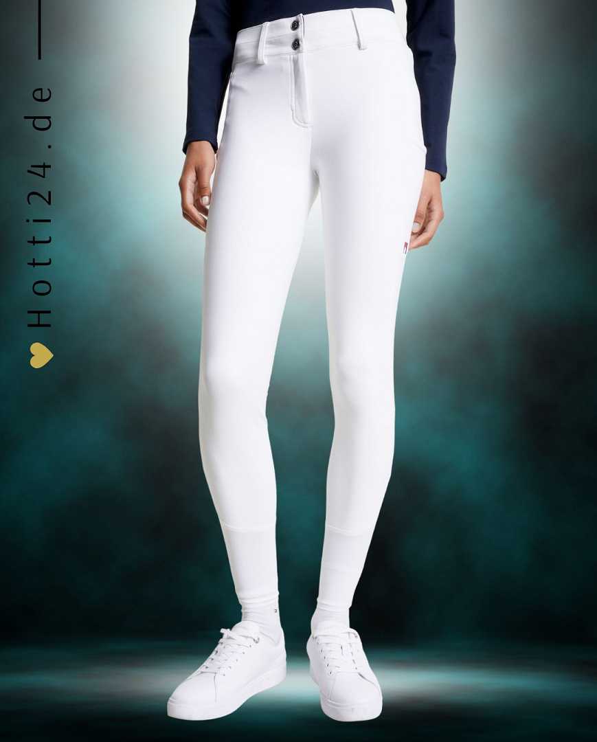 Damen-Reithose von Tommy Hilfiger mit der Bezeichnung "Geneva Fullgrip TH08WFBR464-001" in der Farbe Weiß. Diese Reithose ist auf der Webseite www.hotti24.de erhältlich. Die Hose wurde speziell für Damen entworfen und verfügt über Fullgrip-Elemente, die zusätzlichen Halt während des Reitens bieten sollen.