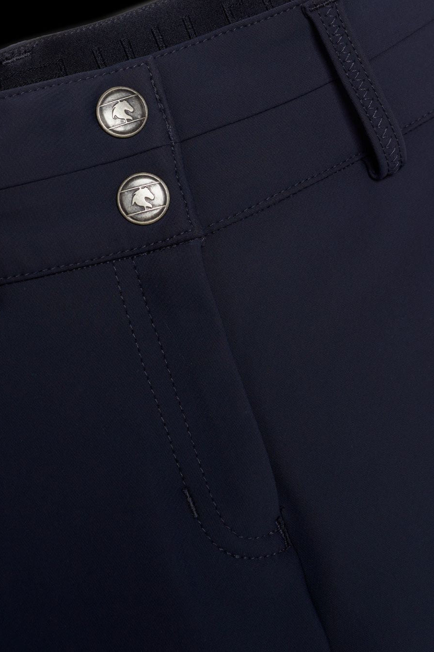 Damen-Reithose von Tommy Hilfiger mit der Bezeichnung "Geneva Fullgrip TH08WFBR464-004" in der Farbe Blau. Diese Reithose ist auf der Webseite www.hotti24.de erhältlich. Die Hose wurde speziell für Damen entwickelt und verfügt über Fullgrip-Elemente, die zusätzlichen Halt während des Reitens bieten sollen.