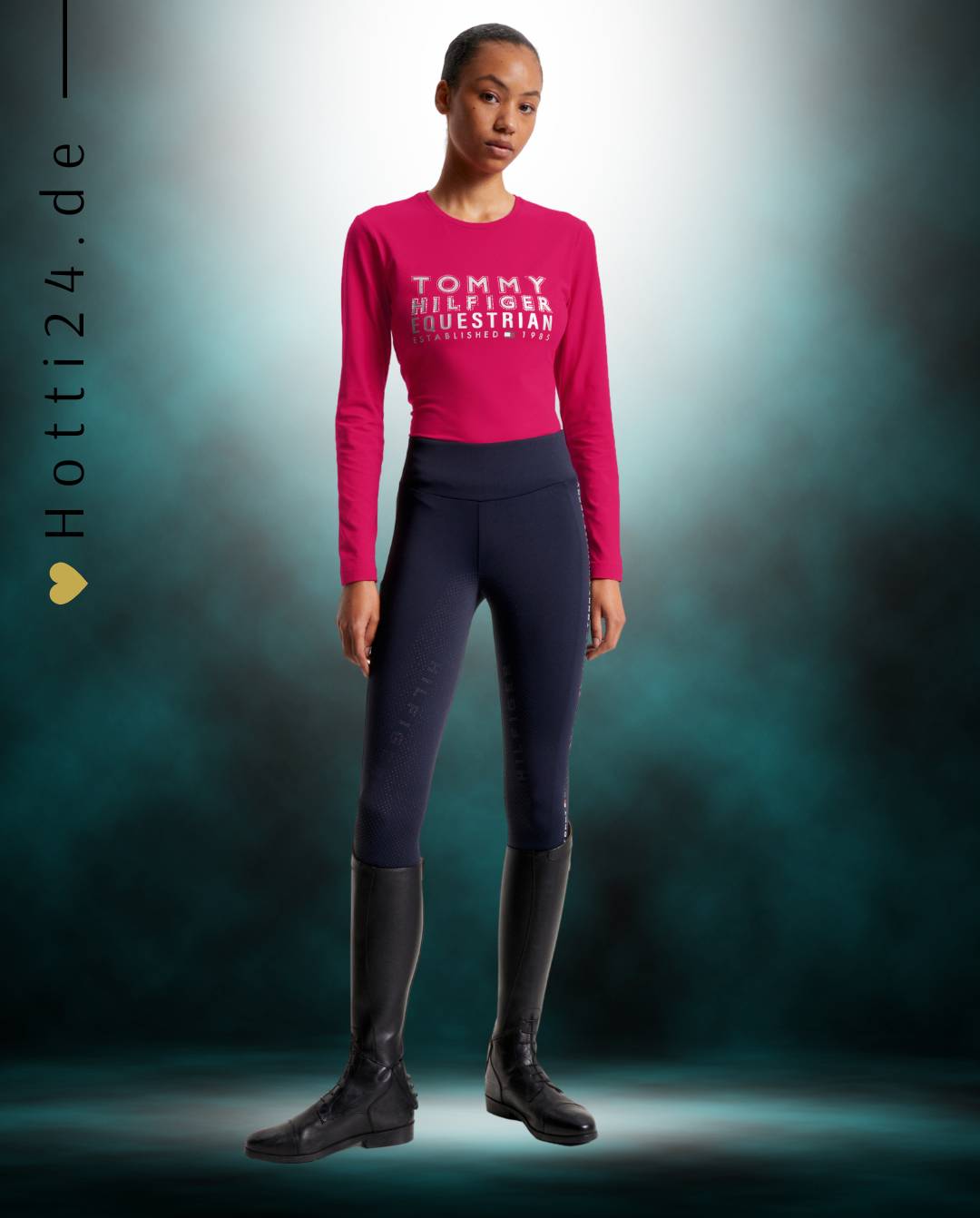 Damen-Trainingshirt von Tommy Hilfiger mit der Bezeichnung "Paris TH08WLST430-040" in der Farbe Pink. Dieses Trainingshirt ist auf der Webseite www.hotti24.de erhältlich. Es wurde speziell für Damen entworfen, um Stil und Komfort während sportlicher Aktivitäten zu bieten.  Zusätzlich sind in der Datei Bilder des Trainingsshirts aus verschiedenen Blickwinkeln enthalten: von vorne, von der Seite und von hinten